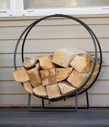 UniFlame W-1890 small log hoop holding firewood on a porch