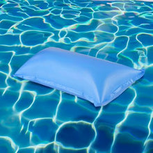 Swimline 4 by 8 foot winter air pillow shown inflated on pool water, angled view