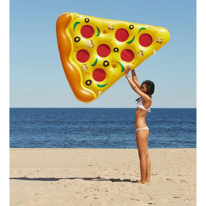 Swimline pizza slice float held up on a beach to show its size