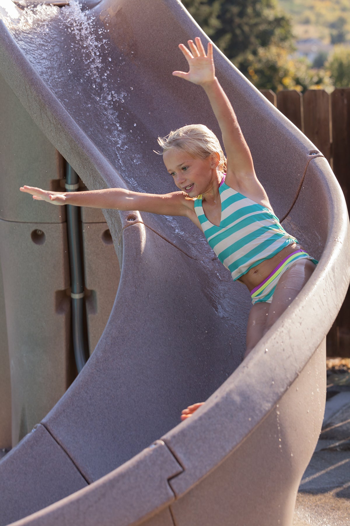 S.R. Smith TurboTwister slide in use by a pool