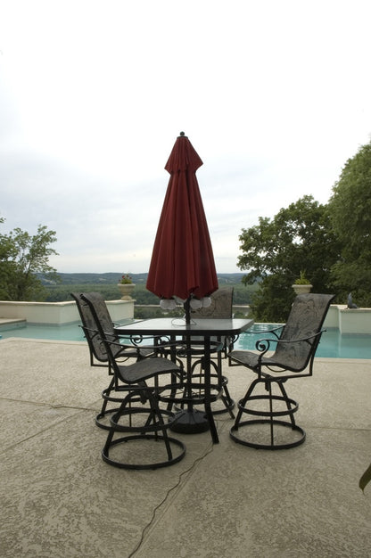 Patio Living Concepts globe lights illuminating a patio umbrella