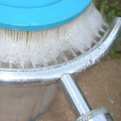 Filter Flosser cleaning tool spraying water between filter cartridge pleats